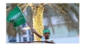 طفل سعودي يلوح بعلم المملكة في العيد الوطني في الرياض في 23 ايلول/سبتمبر 2013 (اف ب/ارشيف, فايز نور الدين)