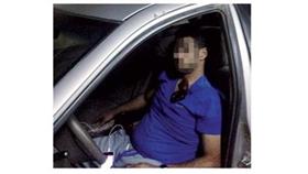 الجاني في صورة التقطها له أحد المارة بعد اطلاقه النار